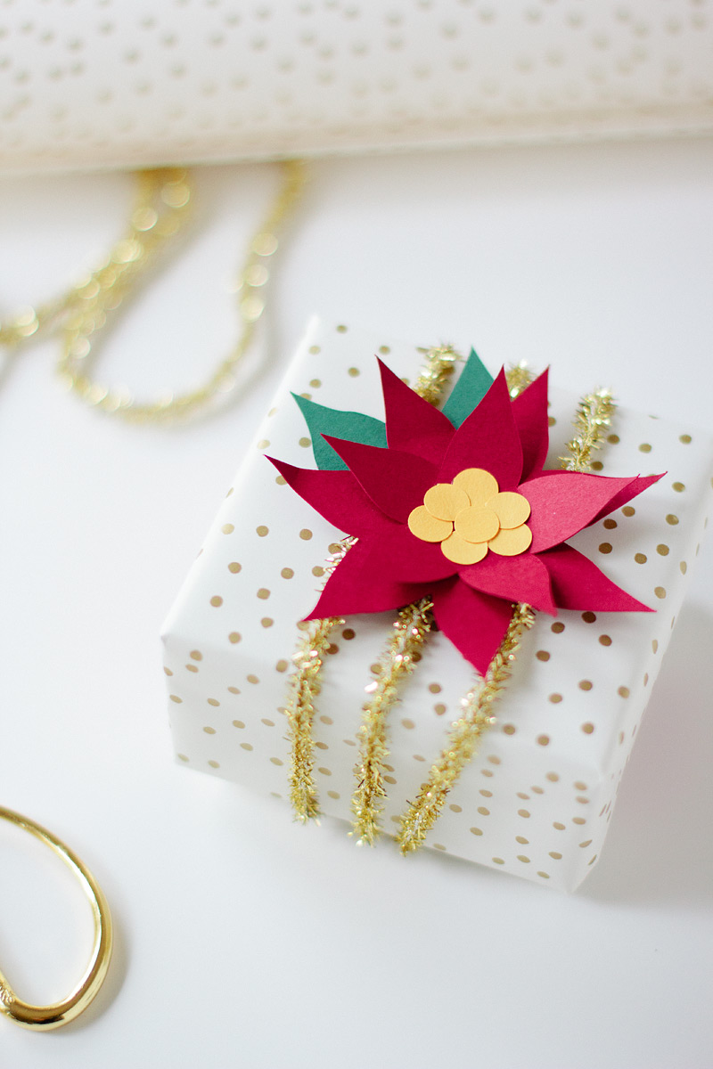 paper poinsettia gift wrap via ANASTASIA MARIE